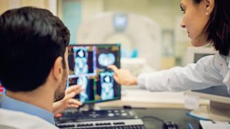 Doctors looking at a computer